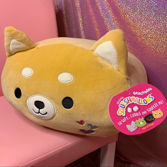 red stuffed dinosaur